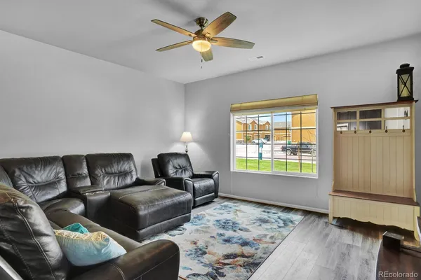 a living room with furniture and a window