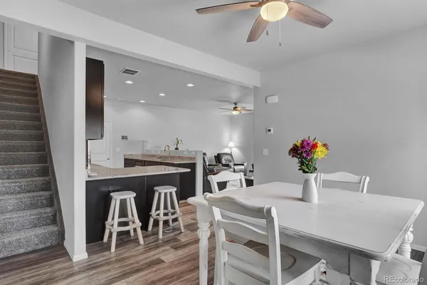 a view of a dining room with furniture and wooden floor