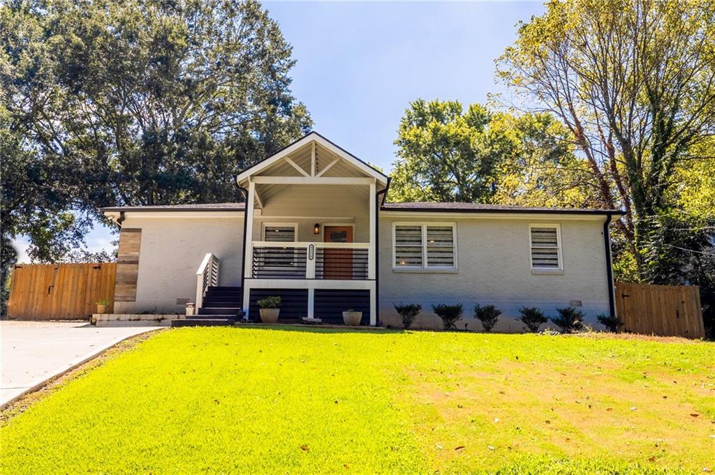 3173 Bluebird Lane Decatur, GA 30032 - Photo 1 of 1 a front view of a house with a swimming pool