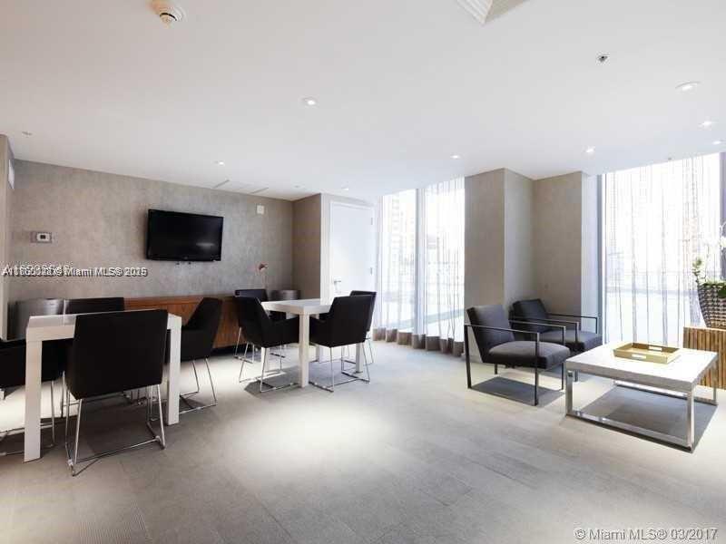 92 Southwest 3rd Street, Unit 3102 Miami, FL 33130 - Photo 11 of 15 a living room with furniture and large windows