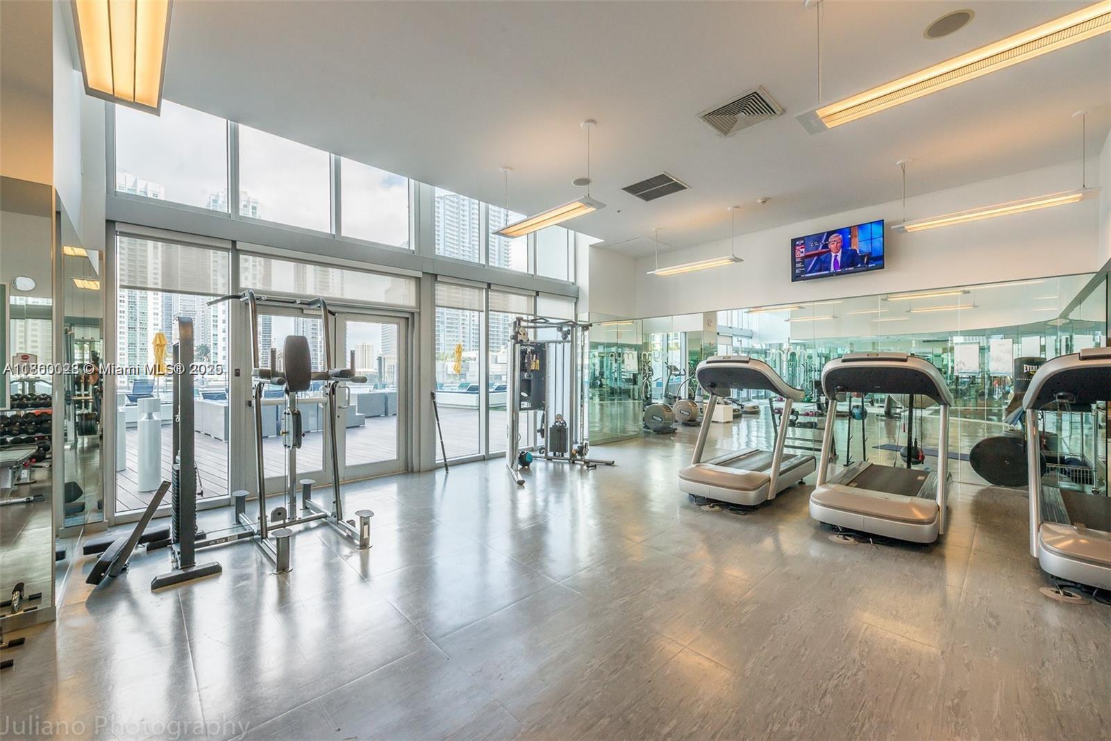 92 Southwest 3rd Street, Unit 3102 Miami, FL 33130 - Photo 9 of 15 a lobby with furniture and floor to ceiling window