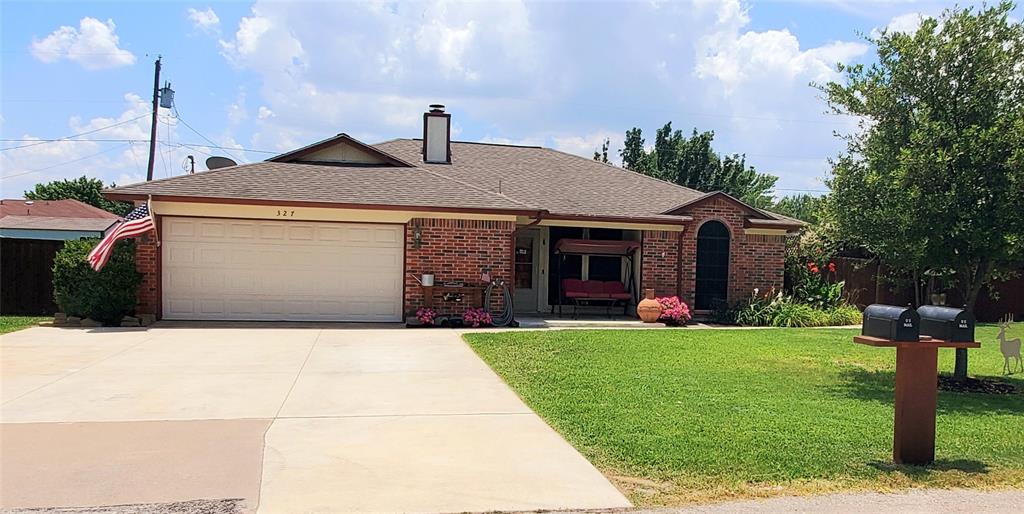 327 Alyse Road Roanoke, TX 76262 - Photo 1 of 1 a front view of a house with a yard and garage
