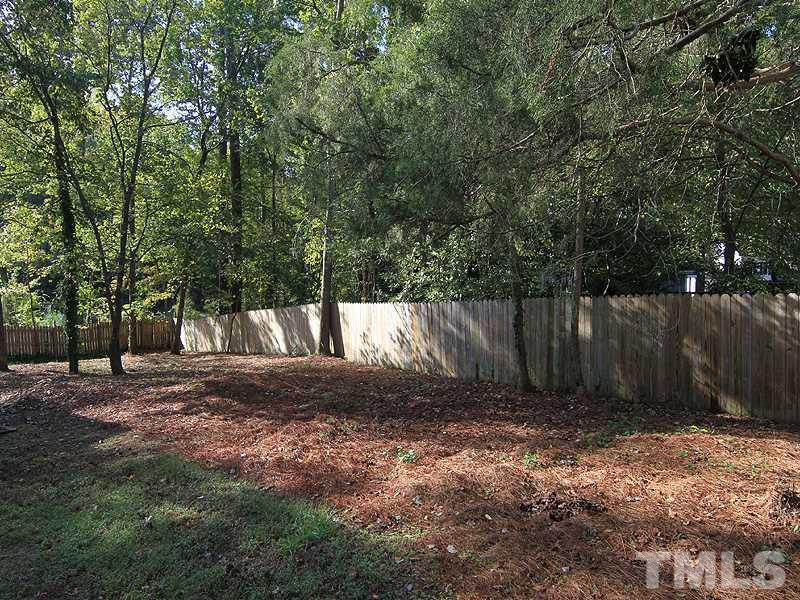 8013 Old Deer Trail Raleigh, NC 27615 - Photo 19 of 23 Large pet and family friendly yard with six foot privacy fence!