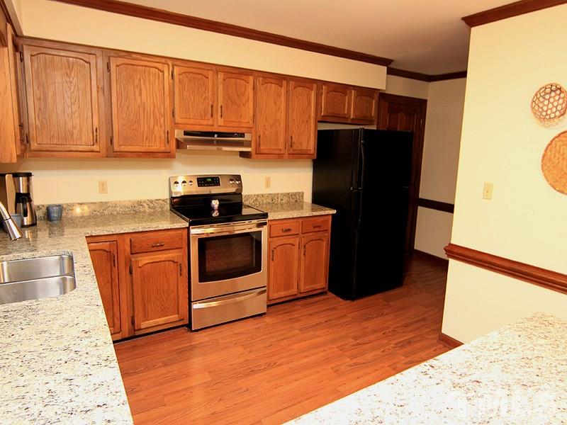8013 Old Deer Trail Raleigh, NC 27615 - Photo 4 of 23 Beautiful granite with new stainless steel sick and faucet, new stainless steel stove and range hood!