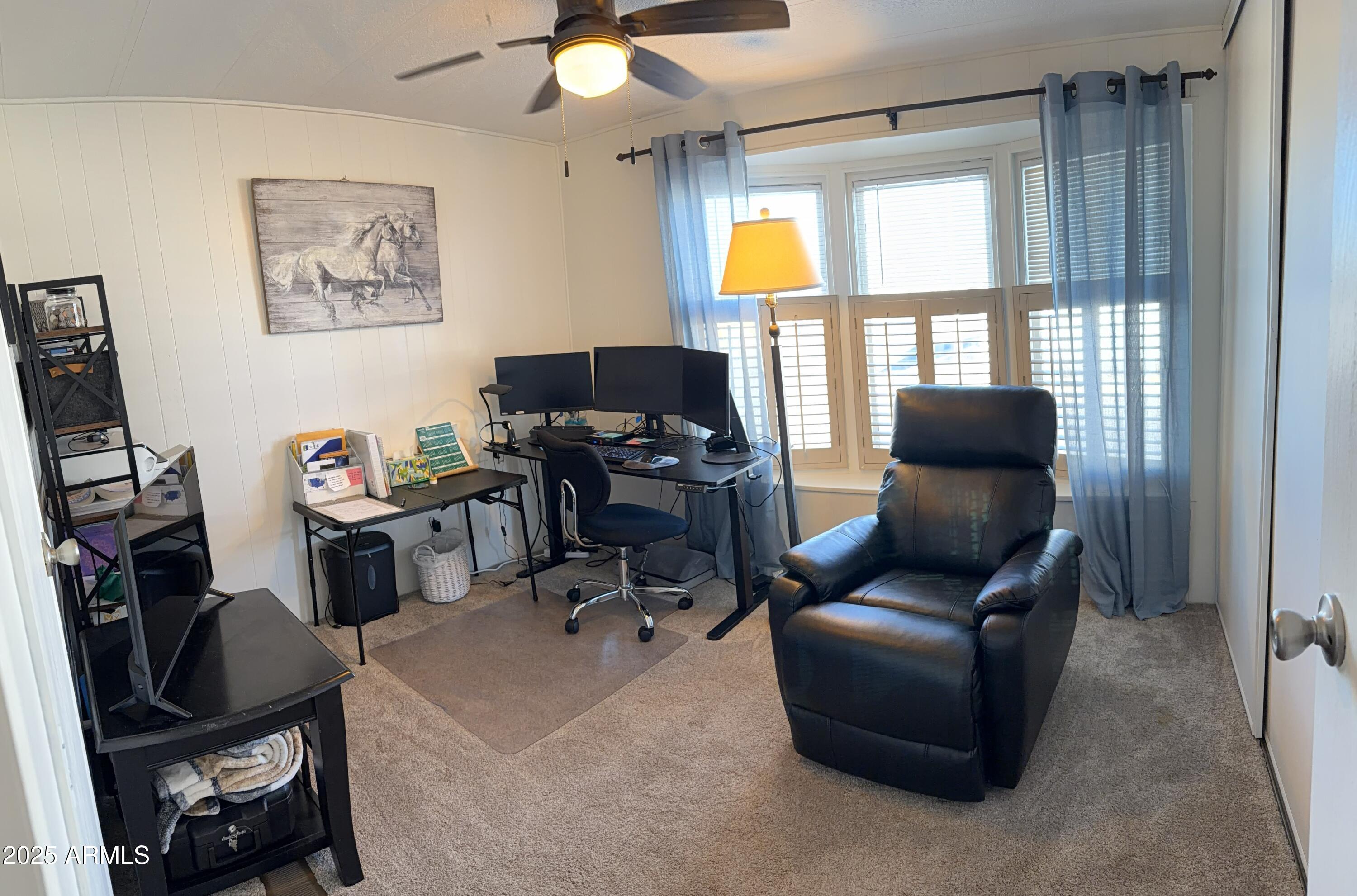 351 North Meridian Drive, Unit 2 Apache Junction, AZ 85120 - Photo 14 of 26 a view of a workspace with furniture and a window