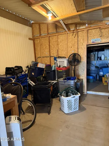 a living room with furniture a flat screen tv and dresser