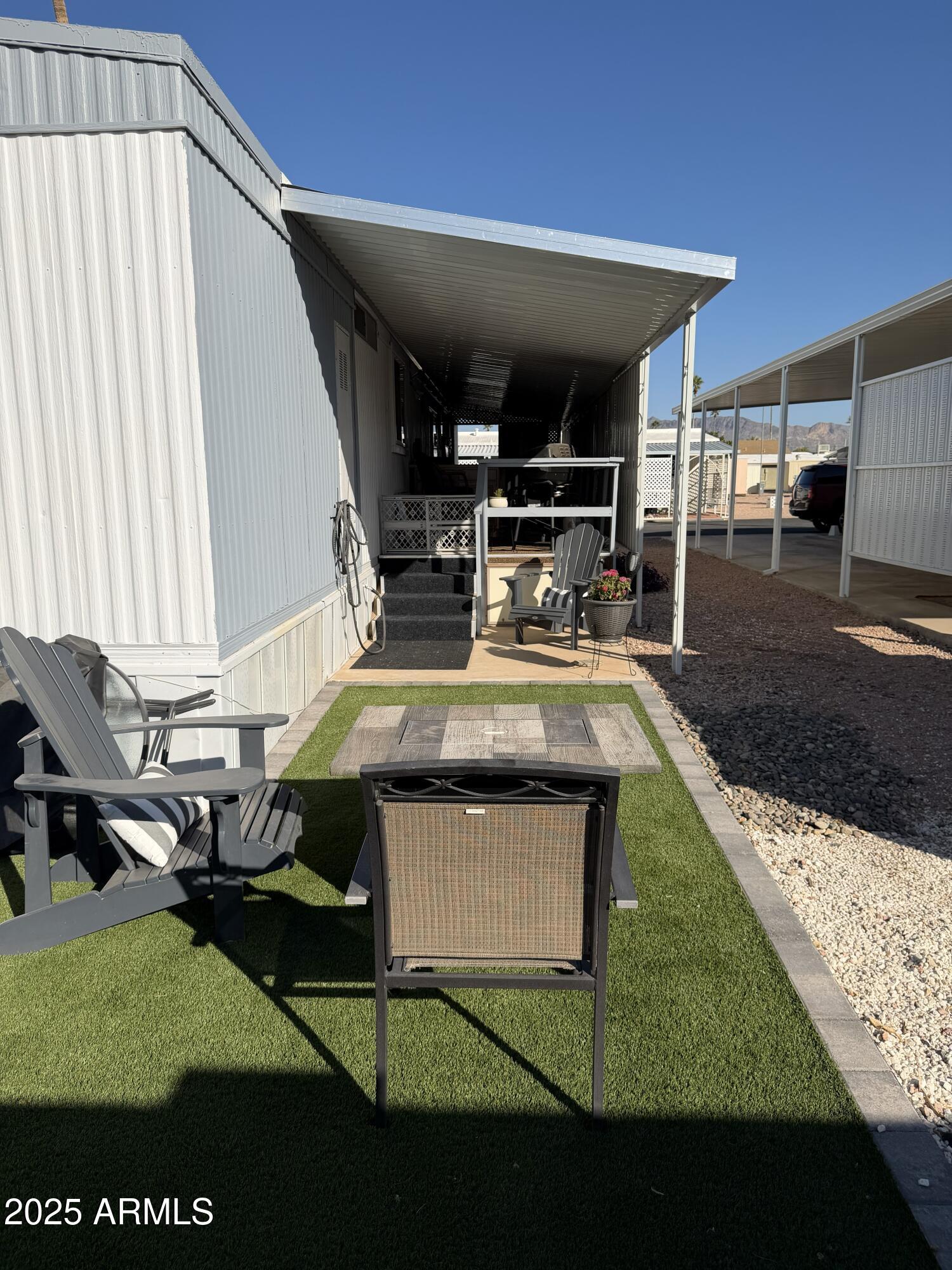 351 North Meridian Drive, Unit 2 Apache Junction, AZ 85120 - Photo 21 of 26 a kitchen with a stove and a table