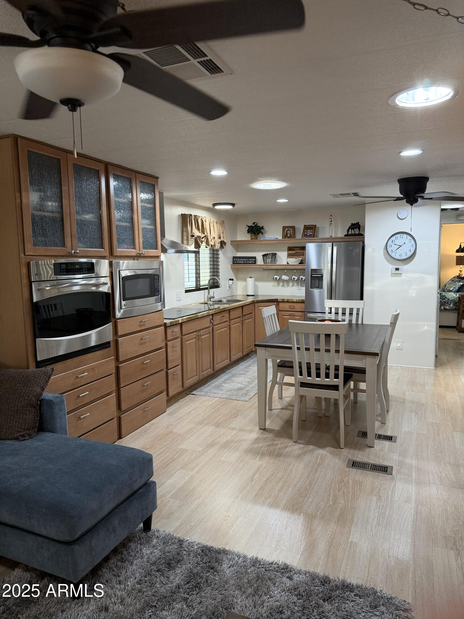351 North Meridian Drive, Unit 2 Apache Junction, AZ 85120 - Photo 6 of 26 a large kitchen with a table and chairs