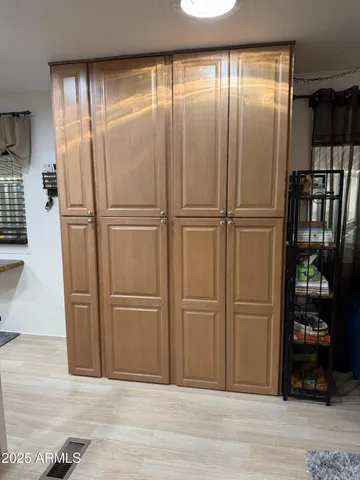 an empty room with wooden floor