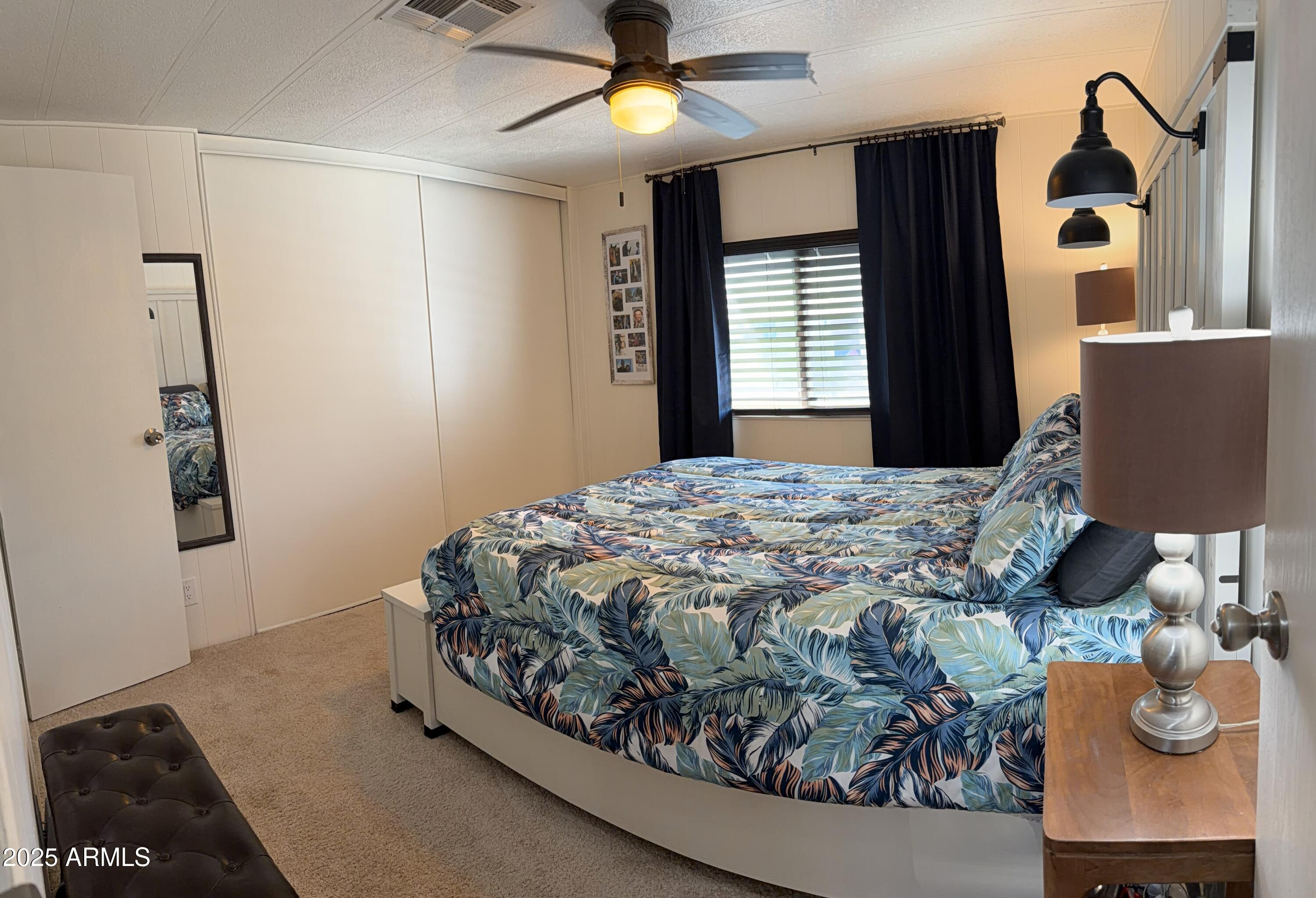 351 North Meridian Drive, Unit 2 Apache Junction, AZ 85120 - Photo 10 of 26 a bedroom with a bed and a window