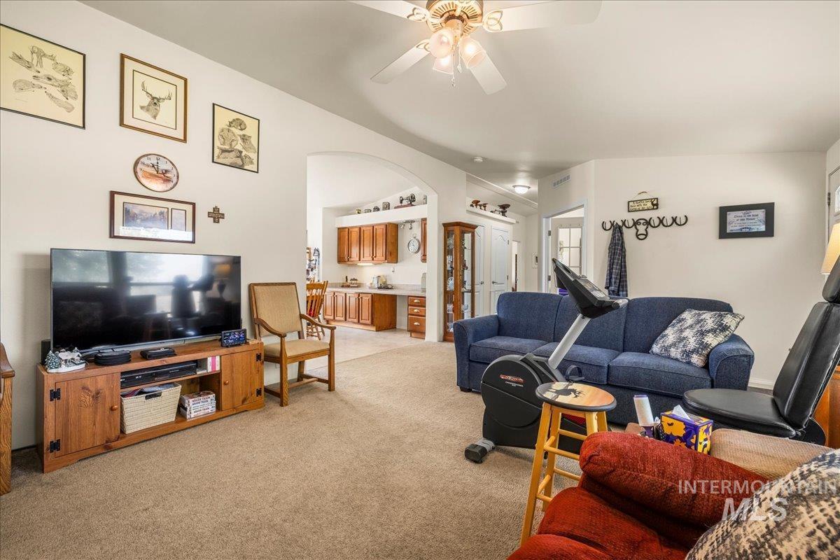 37786 Highway 78 Grand View, ID 83624 - Photo 20 of 50 Living room with light colored carpet and a ceiling fan