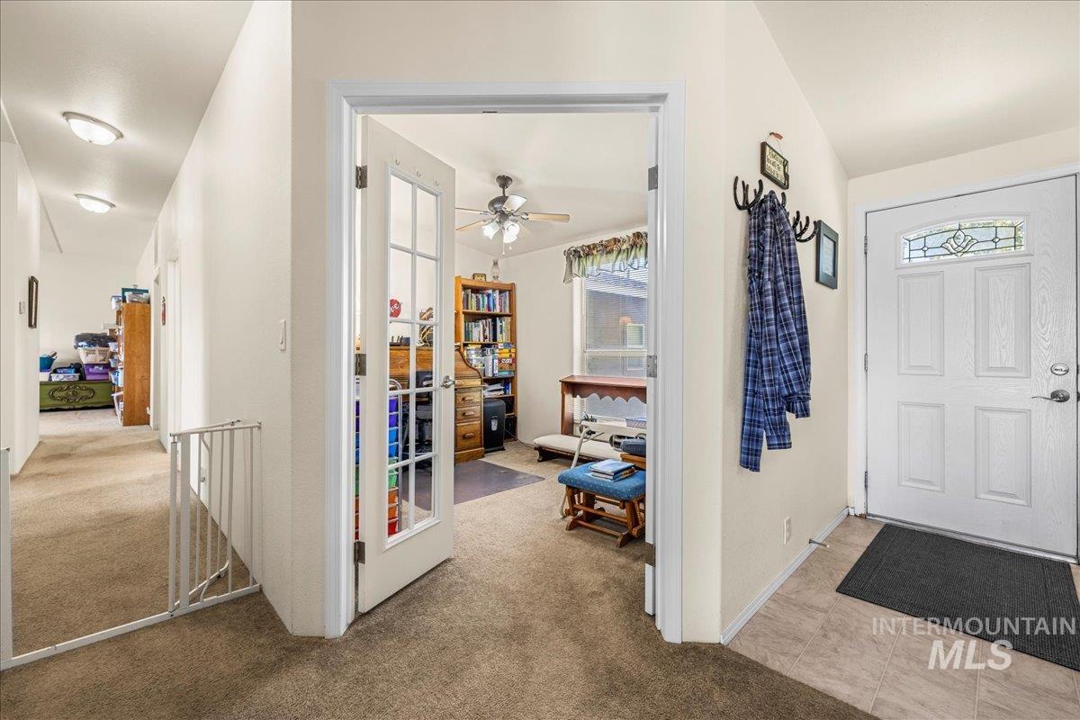 37786 Highway 78 Grand View, ID 83624 - Photo 23 of 50 Entrance foyer with carpet and a ceiling fan