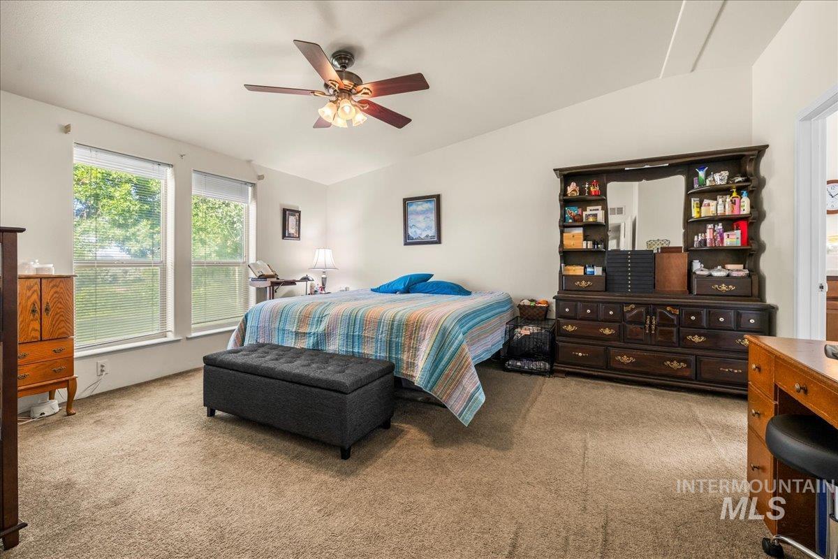37786 Highway 78 Grand View, ID 83624 - Photo 29 of 50 Carpeted bedroom with lofted ceiling and a ceiling fan