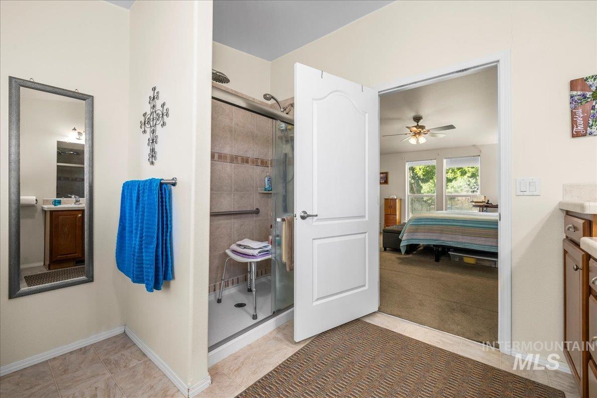37786 Highway 78 Grand View, ID 83624 - Photo 33 of 50 Full bathroom featuring ensuite bathroom, a stall shower, and vanity