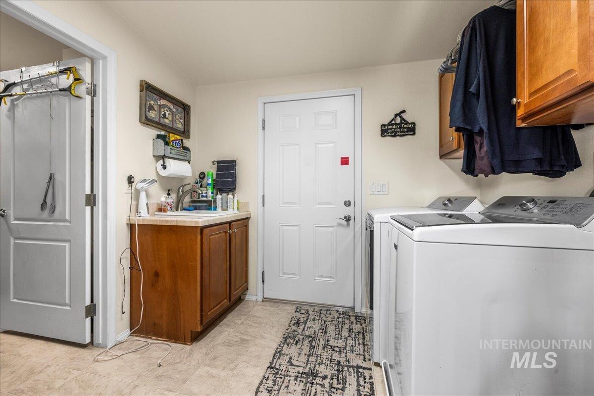 37786 Highway 78 Grand View, ID 83624 - Photo 40 of 50 Laundry room featuring washer and dryer and cabinet space