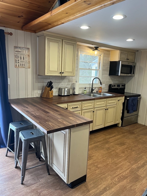 3 Roberts Park Road Holland, MA 01521 - Photo 3 of 15 a kitchen with stainless steel appliances granite countertop a sink a stove and a refrigerator
