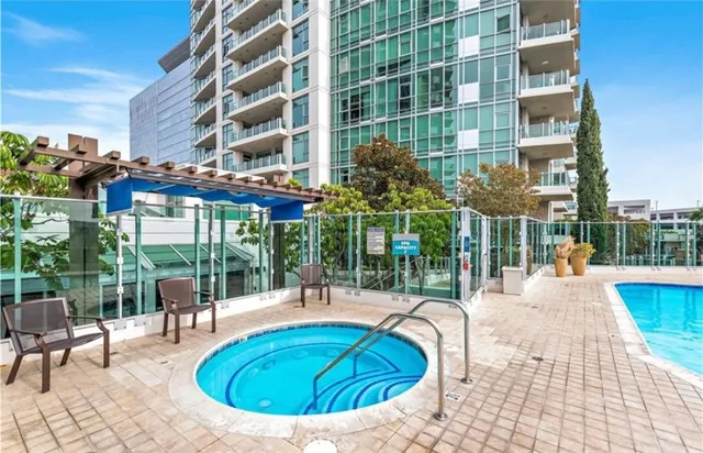 a view of a swimming pool with a patio