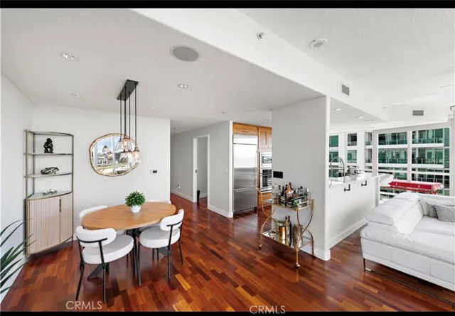 a view of a dining room with furniture window and wooden floor