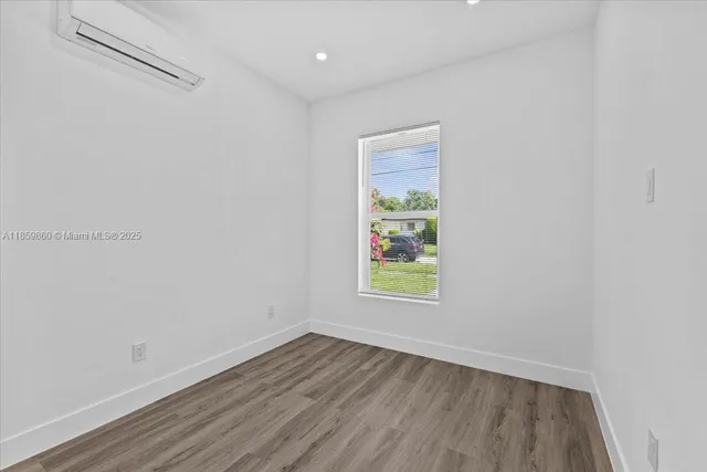 a view of an empty room and window