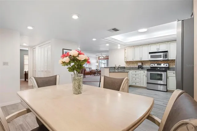 a living room with furniture wooden floor and a table