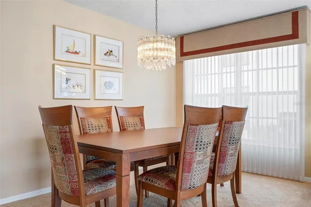 a spacious bedroom with a bed and a flat screen tv