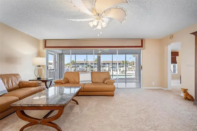a bedroom with a bed and a large mirror on the dresser