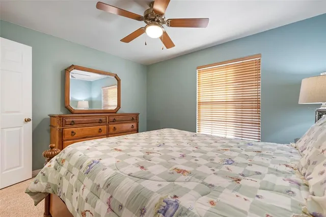 a view of a house with swimming pool and sitting area