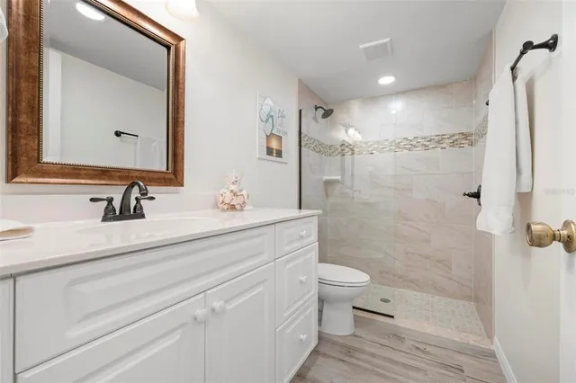 a view of a house with swimming pool and sitting area