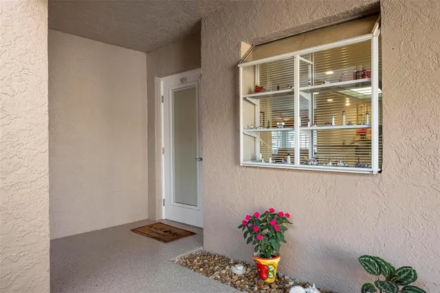 a kitchen with kitchen island a counter top space cabinets and stainless steel appliances
