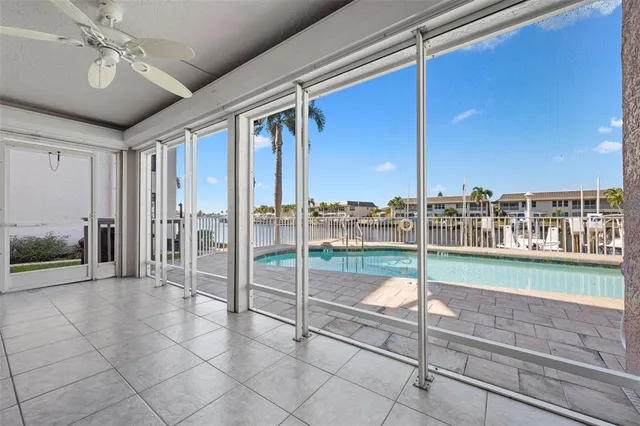 an aerial view of a house with a lake view