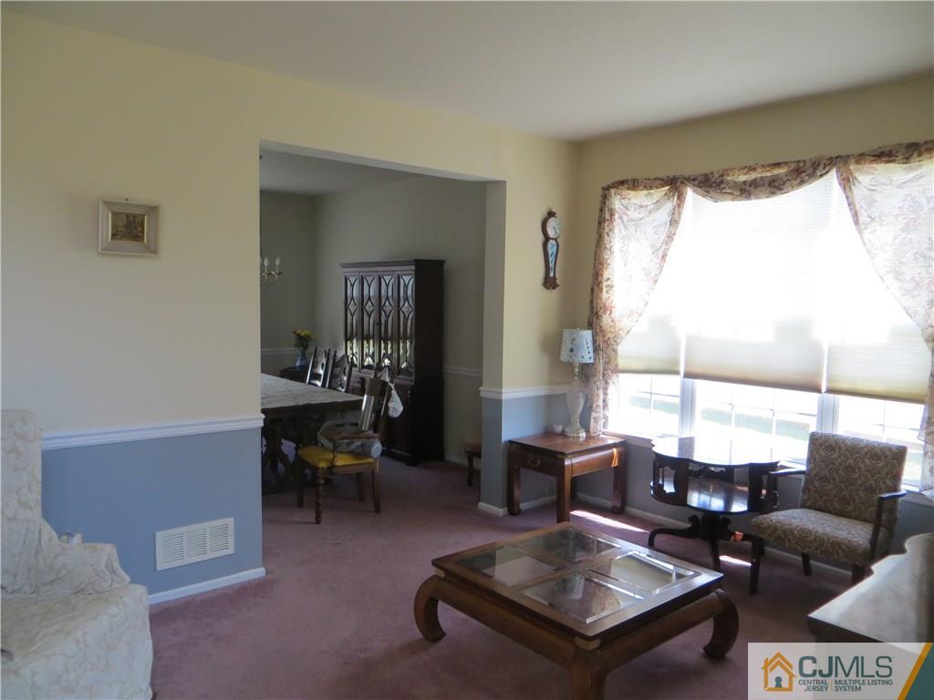 51 Stratton Road Old Bridge, NJ 07747 - Photo 4 of 25 a living room with furniture and a large window