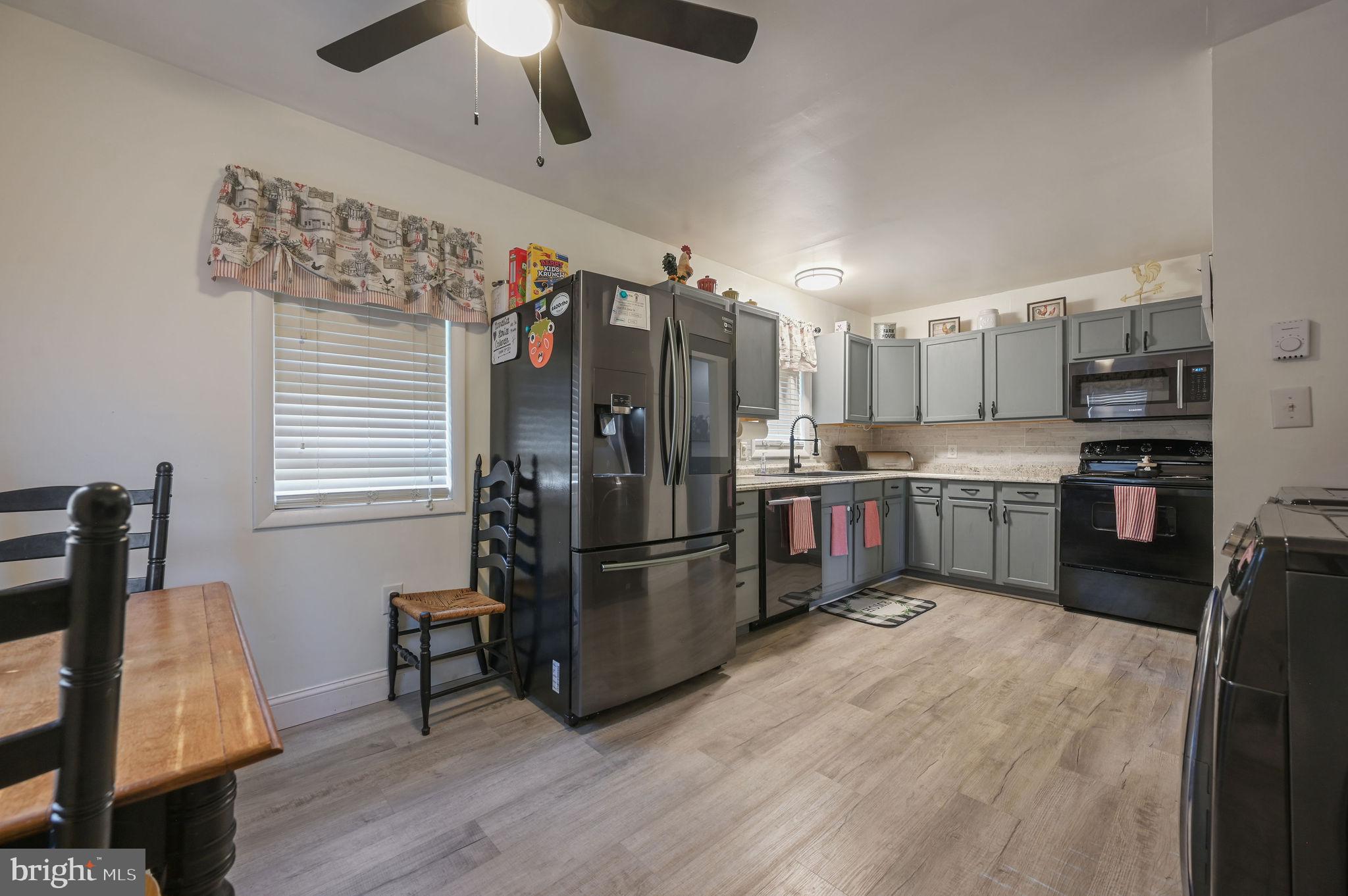 2314 Lockwood Chapel Road Dover, DE 19904 - Photo 13 of 20 a kitchen with stainless steel appliances granite countertop a refrigerator and a stove top oven