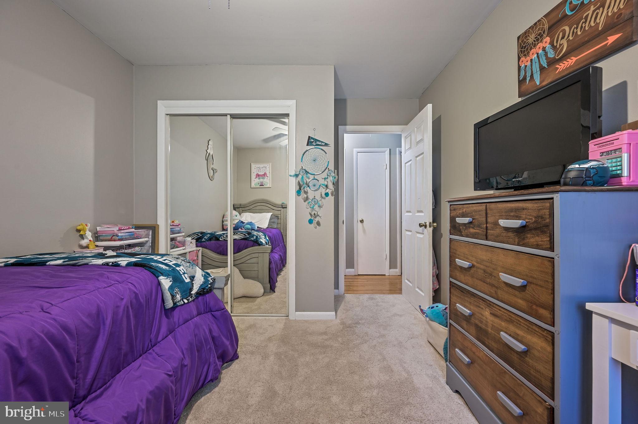 2314 Lockwood Chapel Road Dover, DE 19904 - Photo 16 of 20 a bed room with a bed and a flat screen tv