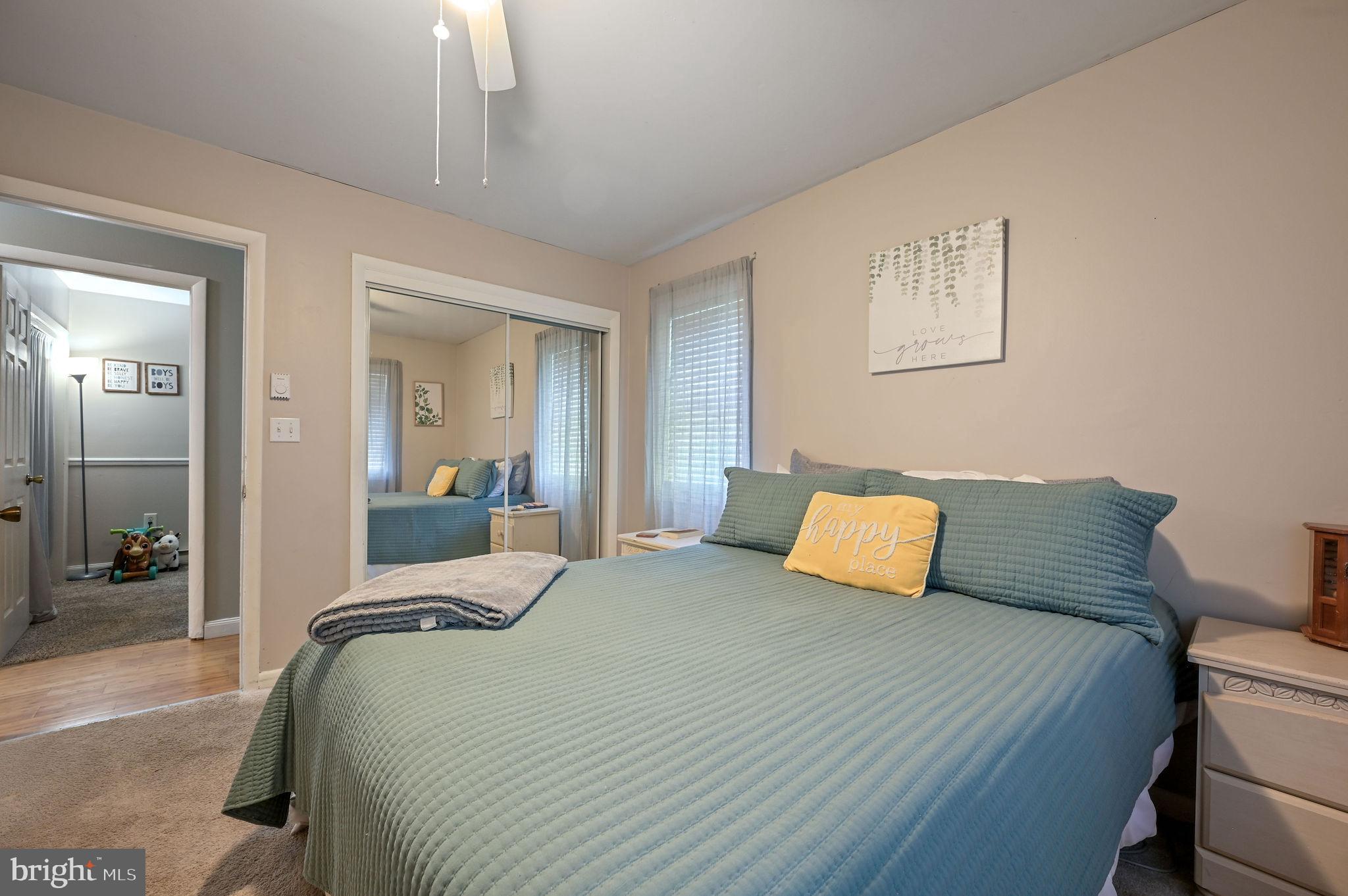 2314 Lockwood Chapel Road Dover, DE 19904 - Photo 20 of 20 a bedroom with a bed and wooden floor