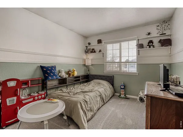 a bedroom with bed and a dresser
