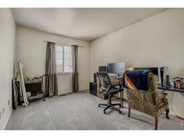 a workspace with furniture and a window