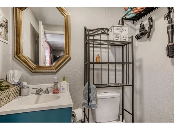 a bathroom with a sink mirror and vanity