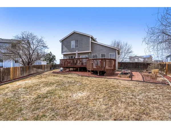 a view of a house with a yard covered in snow