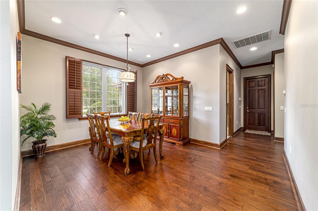 678 Southeast 47th Loop Ocala, FL 34480 - Photo 11 of 73 a view of a a dining room with furniture window and wooden floor