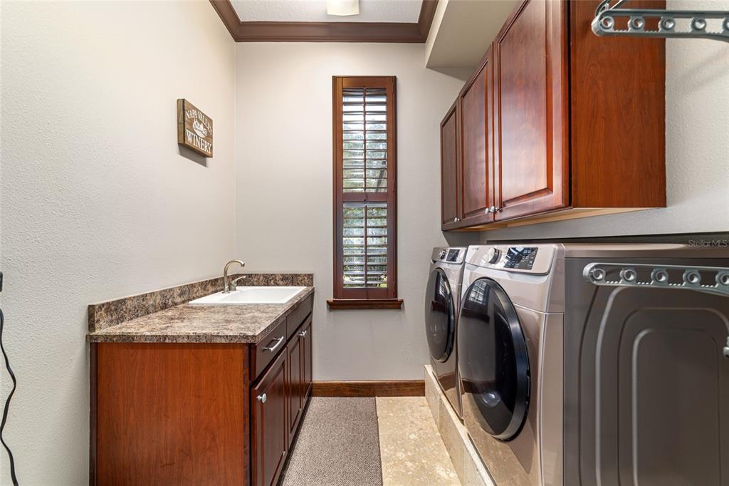 678 Southeast 47th Loop Ocala, FL 34480 - Photo 26 of 73 a utility room with dryer and washer