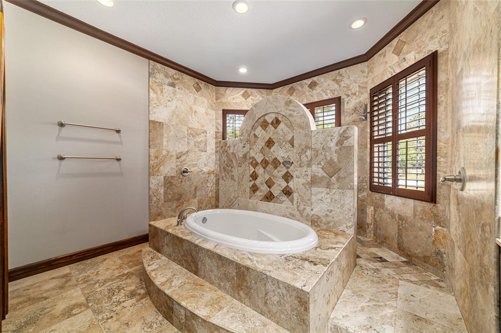 678 Southeast 47th Loop Ocala, FL 34480 - Photo 36 of 73 a bathroom with a sink and a mirror