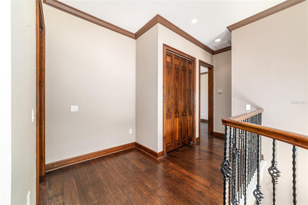 678 Southeast 47th Loop Ocala, FL 34480 - Photo 45 of 73 a view of a hallway with wooden floor and entryway