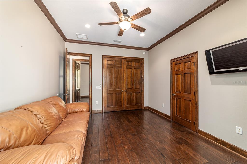 678 Southeast 47th Loop Ocala, FL 34480 - Photo 47 of 73 a living room with furniture ceiling fan and a wooden floor