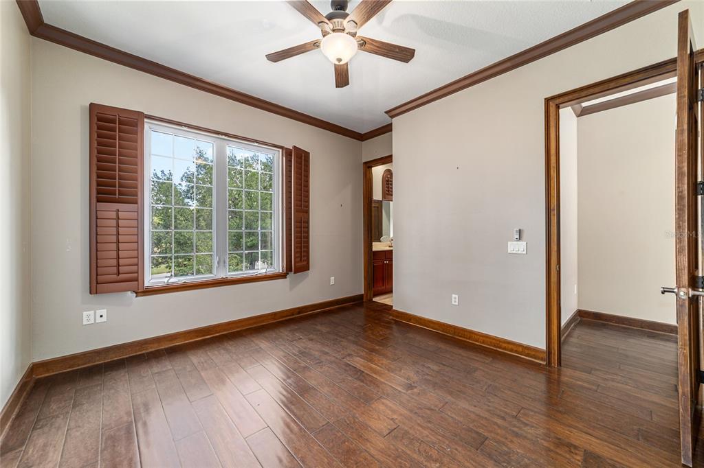 678 Southeast 47th Loop Ocala, FL 34480 - Photo 49 of 73 a view of an empty room with wooden floor and a window