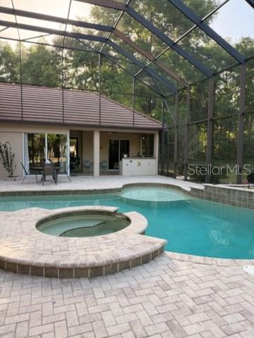 678 Southeast 47th Loop Ocala, FL 34480 - Photo 61 of 73 a view of a swimming pool with a patio