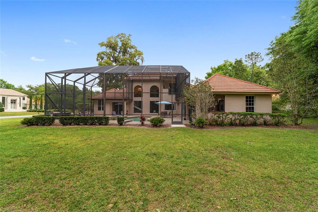 678 Southeast 47th Loop Ocala, FL 34480 - Photo 66 of 73 a front view of a house with a garden