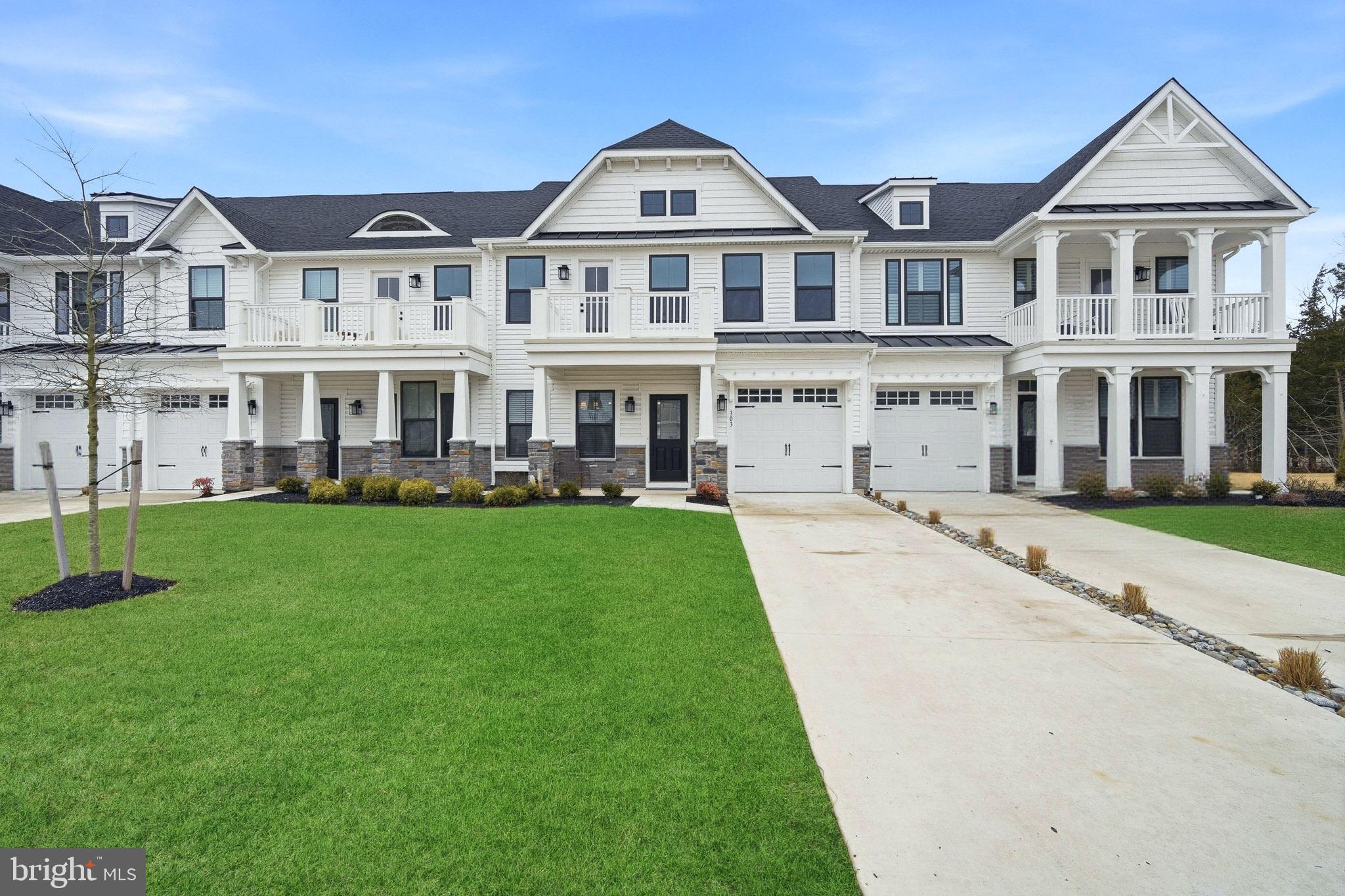 a front view of a building with a yard