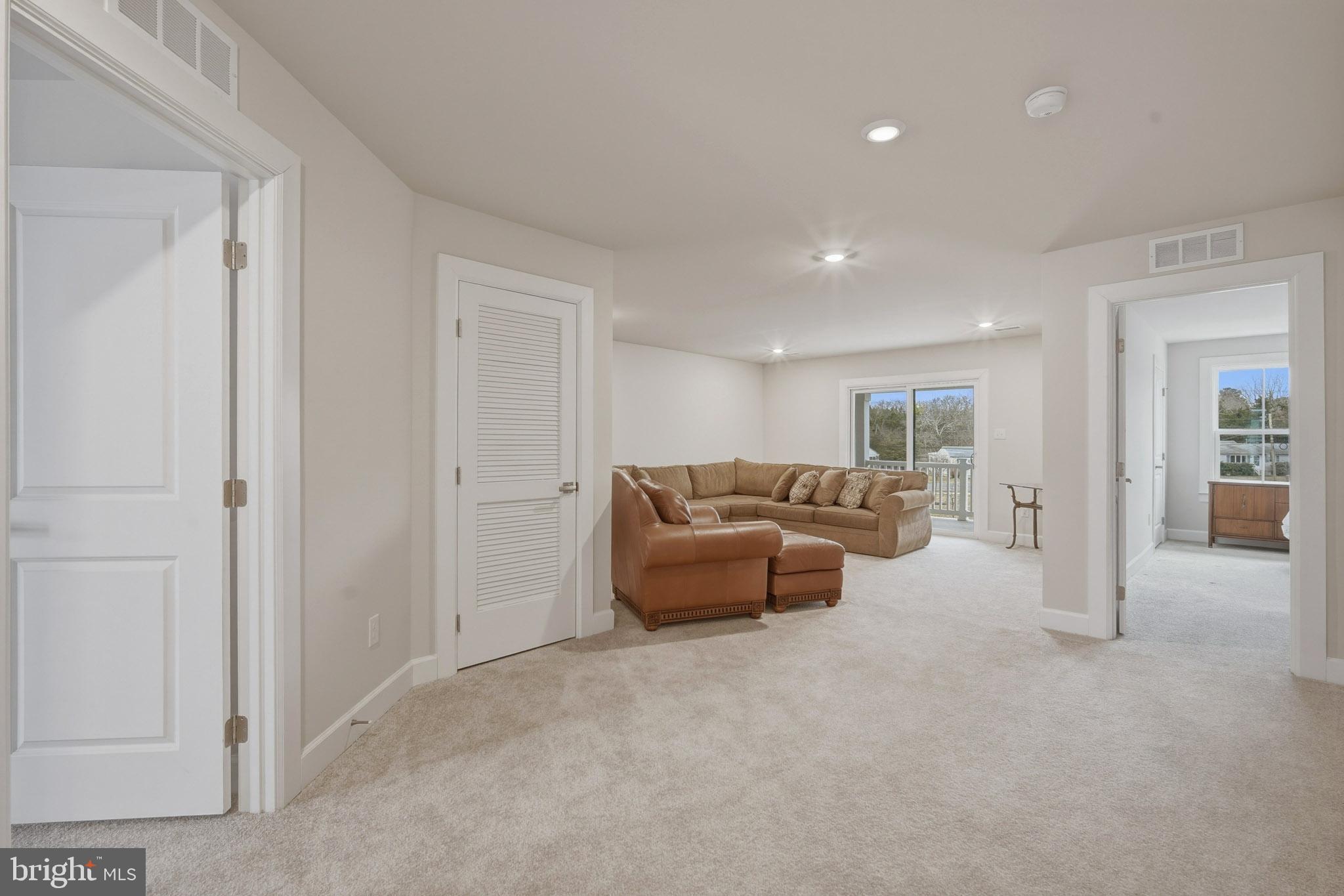 303 Southgate Road Cape May Court House, NJ 08210 - Photo 17 of 25 a living room with furniture and a to ceiling window