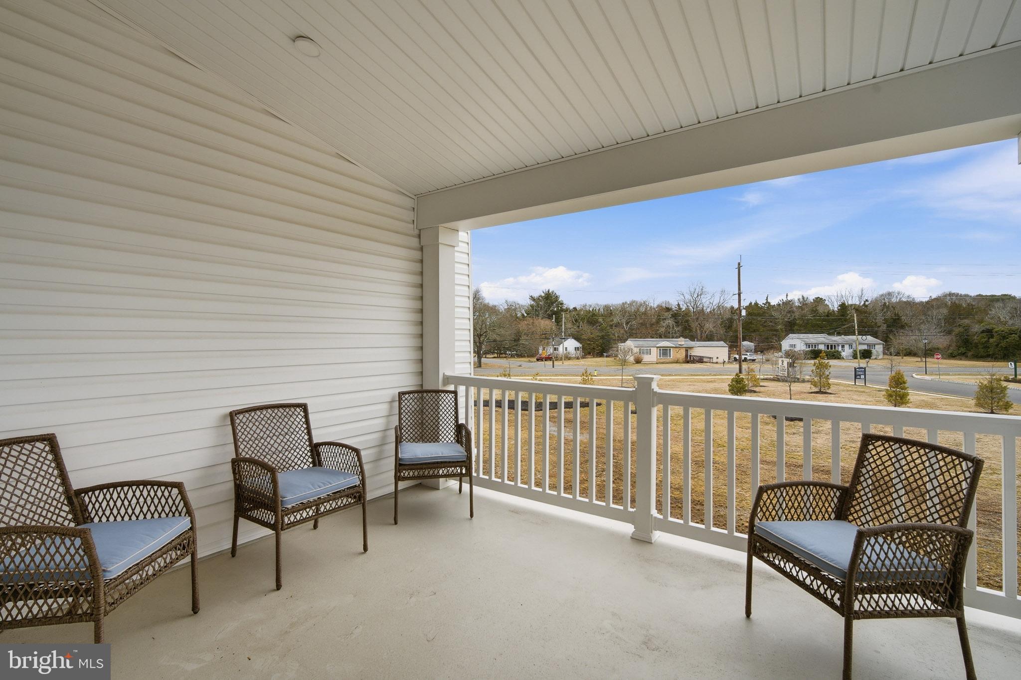 303 Southgate Road Cape May Court House, NJ 08210 - Photo 19 of 25 a view of a chair and tables in the balcony
