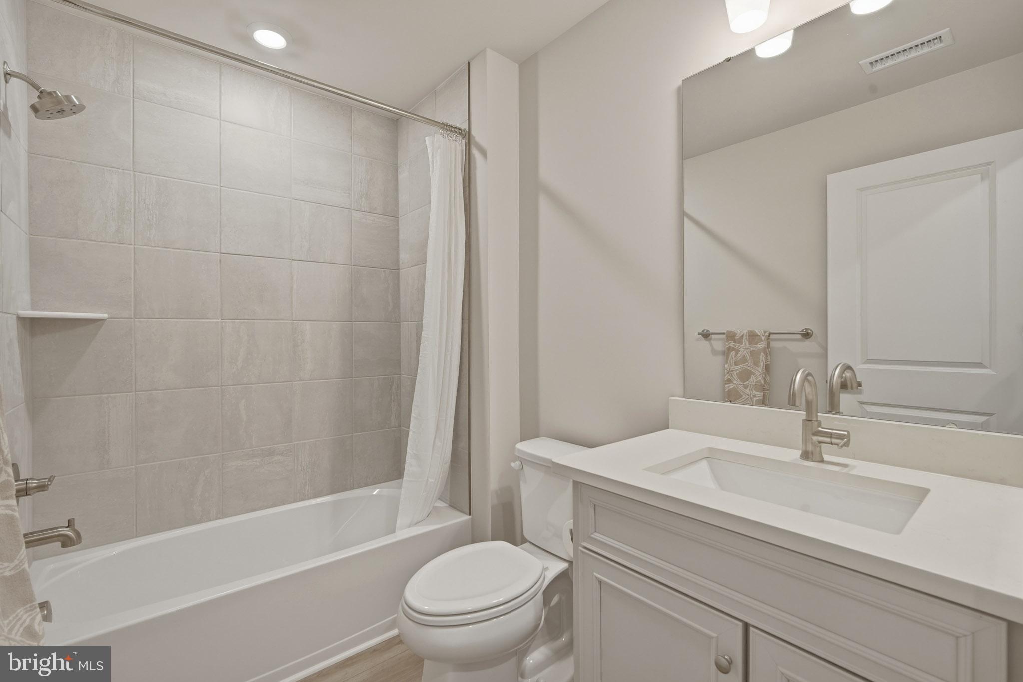 303 Southgate Road Cape May Court House, NJ 08210 - Photo 24 of 25 a bathroom with a sink a toilet and a bathtub